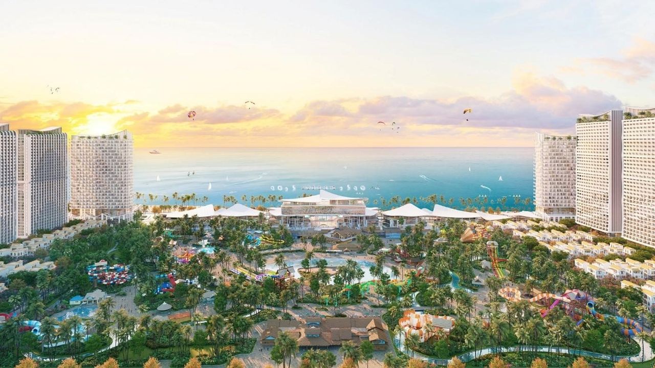 Phối cảnh trục công viên Blanca City mở ra biển: thảm cỏ, hàng dừa và quảng trường dẫn xuống bãi biển, hai bên là tháp căn hộ