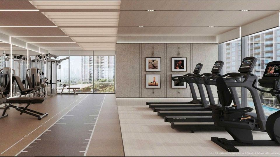 Phối cảnh phòng gym Imperia Sensa Park với máy chạy bộ xếp dọc vách kính nhìn ra hai tháp